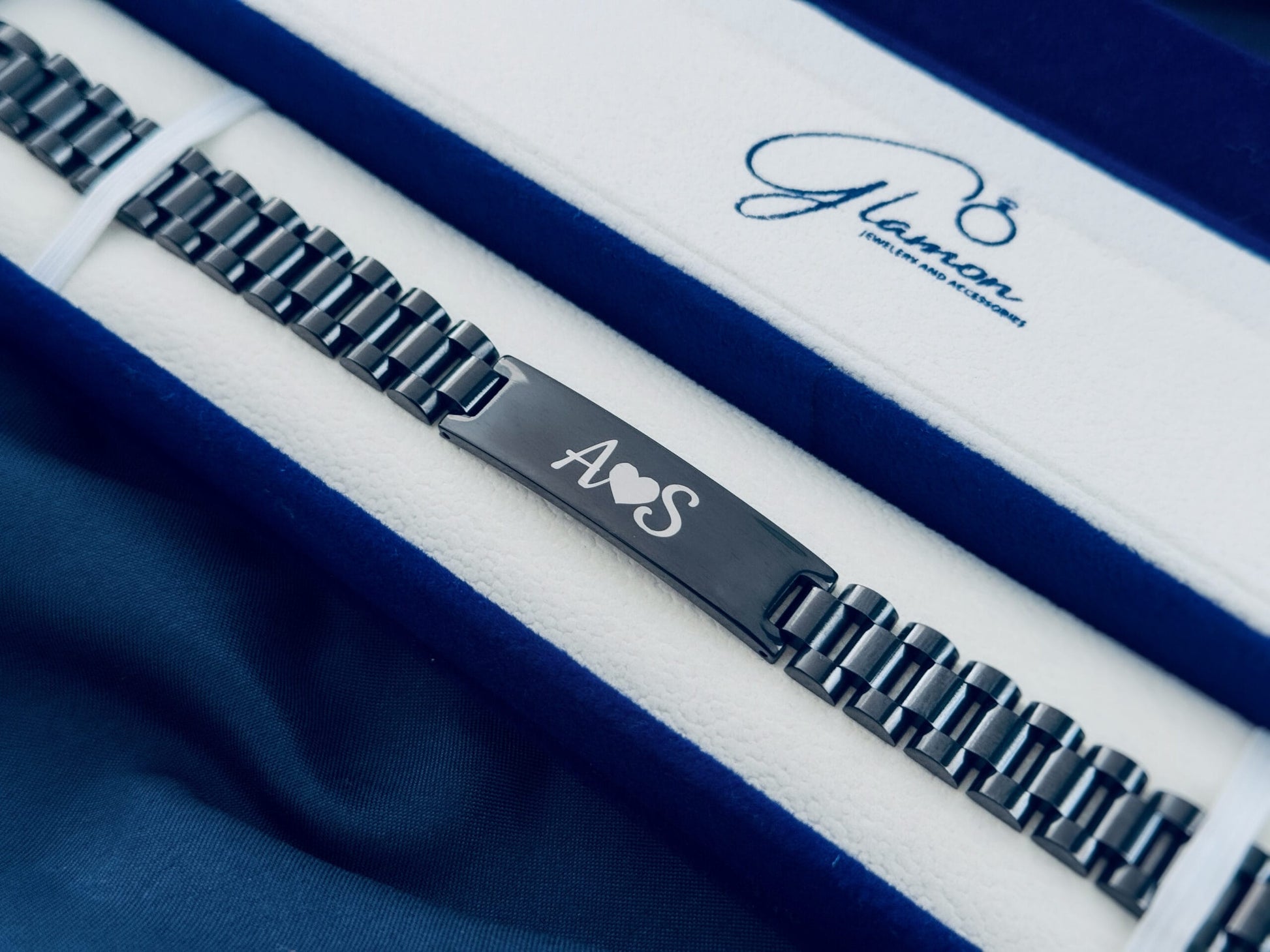 Close-up of engraved name bracelet for men black stainless steel personalized